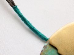 Close up of thread detail, matching the colours to those in the colours on the metal.